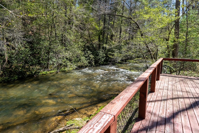 wooden deck featuring a wooded view