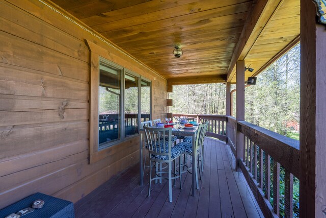 deck with outdoor dining area