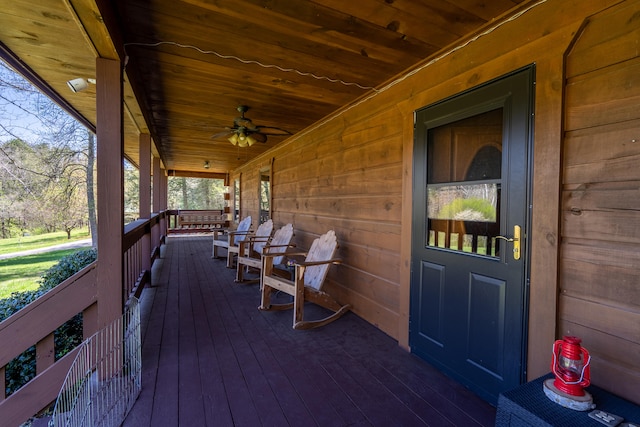 deck featuring a porch and ceiling fan