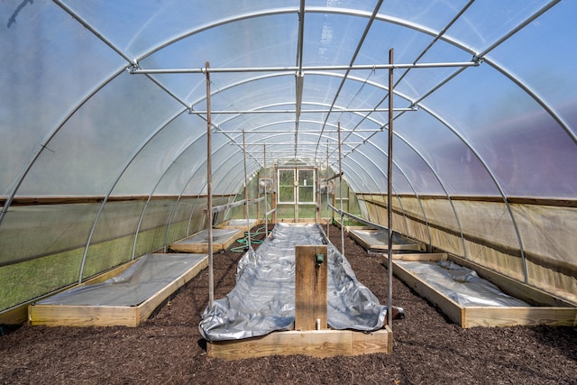 exterior space featuring an outbuilding, an exterior structure, and a vegetable garden