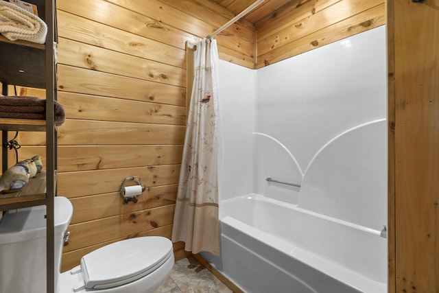 full bathroom with toilet, wood walls, and shower / bath combo