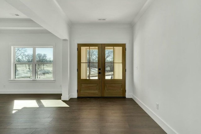 doorway with ornamental molding, dark hardwood / wood-style flooring, and french doors