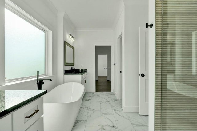full bathroom featuring a stall shower, a soaking tub, marble finish floor, crown molding, and vanity