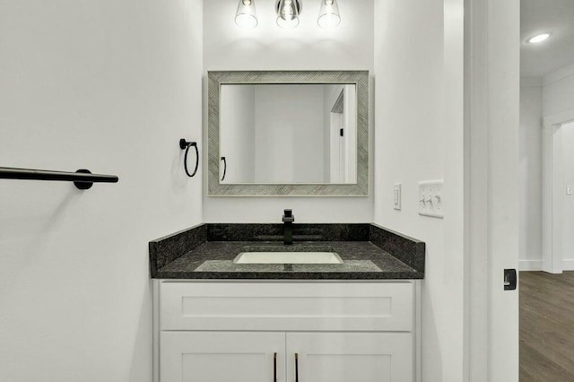 bathroom featuring vanity and hardwood / wood-style floors