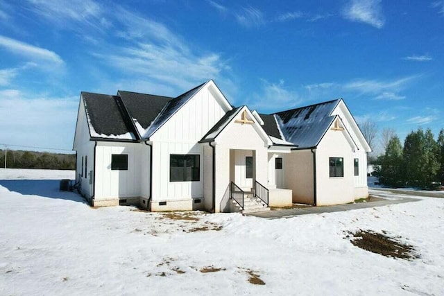 view of snow covered house