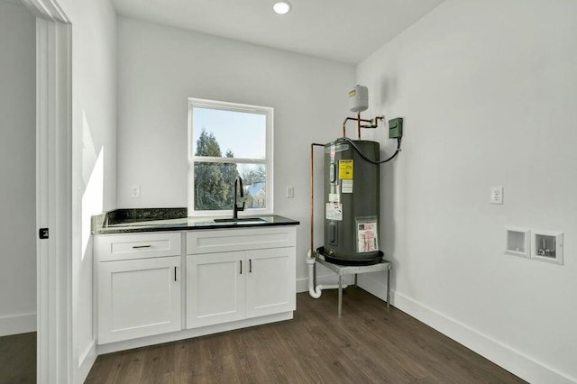 interior space featuring sink and electric water heater