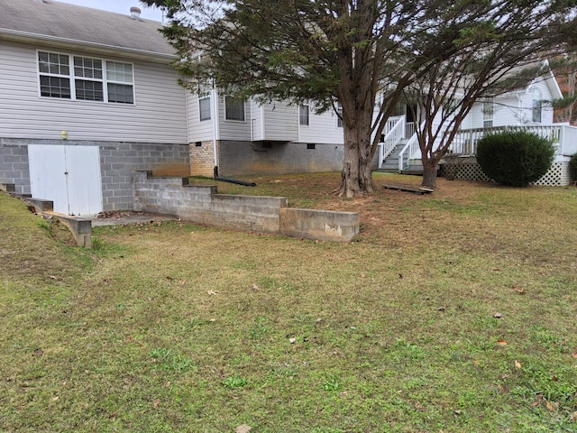 view of yard with a wooden deck