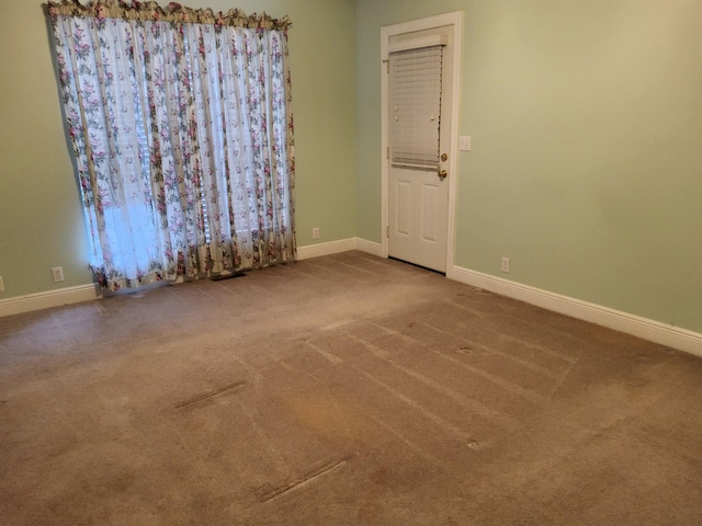 empty room featuring carpet flooring