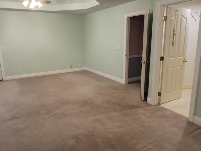 unfurnished room with light carpet and ceiling fan