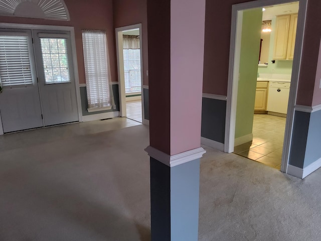 view of carpeted foyer