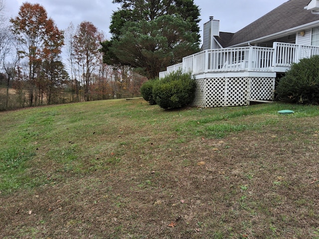 view of yard with a wooden deck