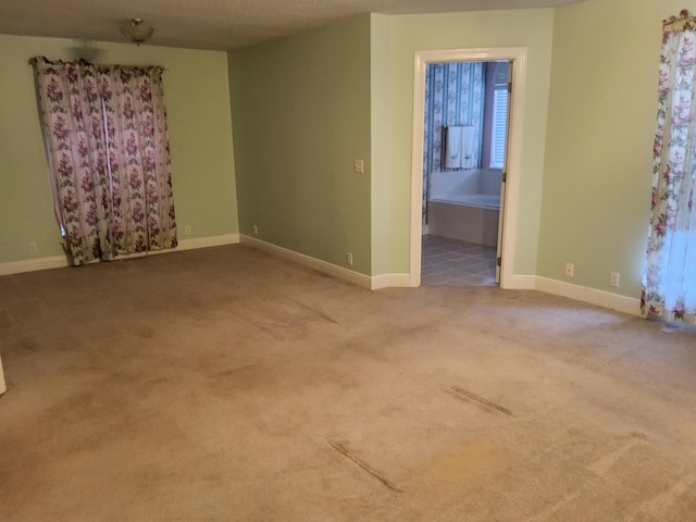 empty room featuring carpet flooring