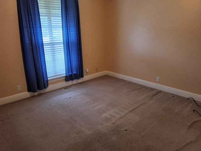 spare room featuring carpet flooring