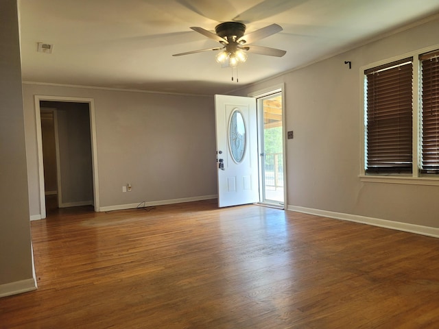 entryway featuring ornamental molding, hardwood / wood-style floors, and ceiling fan