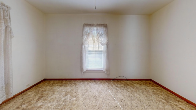 empty room with carpet flooring