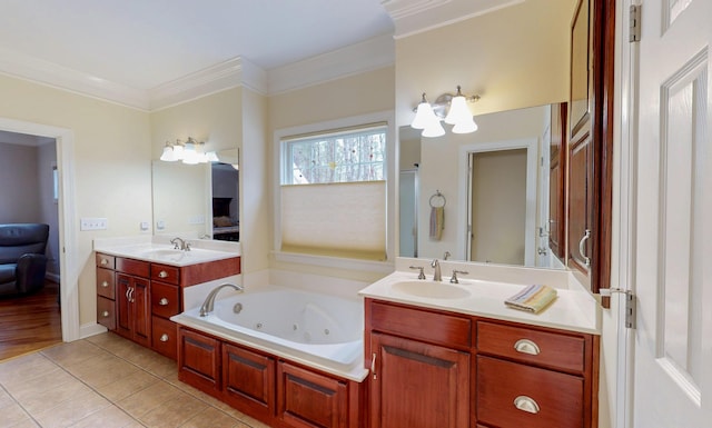 full bathroom featuring tile patterned flooring, crown molding, a whirlpool tub, and a sink