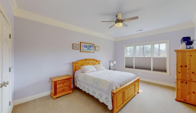 bedroom featuring a ceiling fan, crown molding, light colored carpet, and baseboards