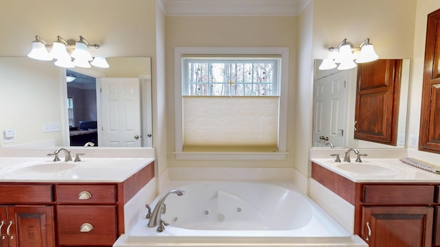 full bathroom featuring two vanities, a whirlpool tub, and a sink