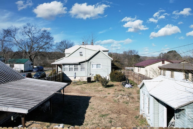 view of side of home featuring central AC