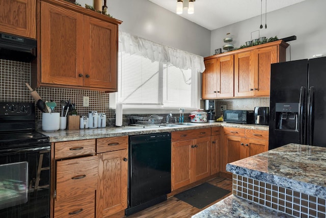 kitchen with sink, black appliances, decorative backsplash, and dark hardwood / wood-style flooring