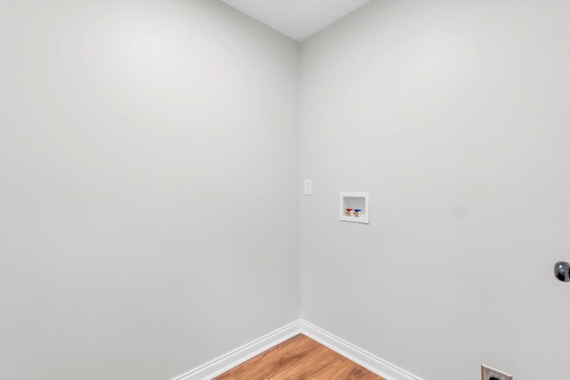 1050 King Edward Ave SE, Cleveland, TN 37311 - laundry room featuring hookup for a washing machine, light wood finished floors, and electric dryer hookup