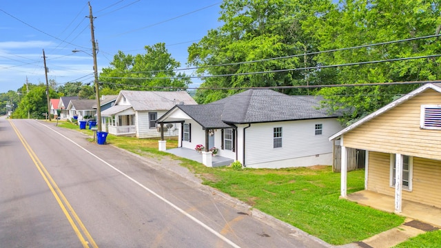 1050 King Edward Ave SE, Cleveland, TN 37311 - view of front of property with a front lawn and a shingled roof