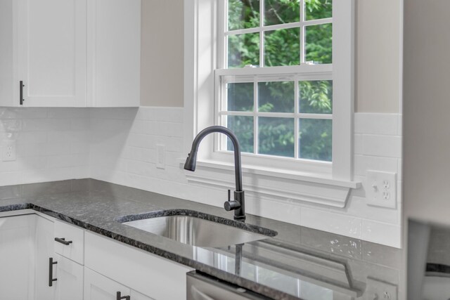 1050 King Edward Ave SE, Cleveland, TN 37311 - kitchen featuring white cabinetry, dark stone countertops, and decorative backsplash