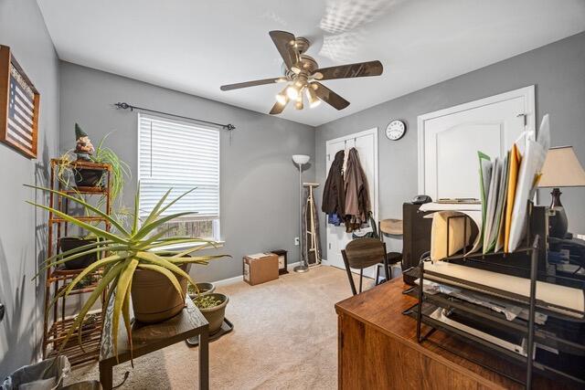 office area with light carpet and ceiling fan