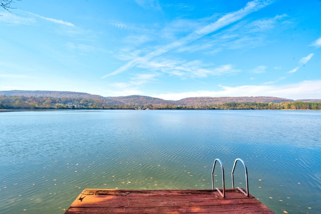 dock area featuring a water and mountain view