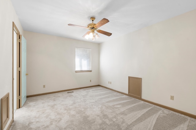 carpeted empty room featuring ceiling fan