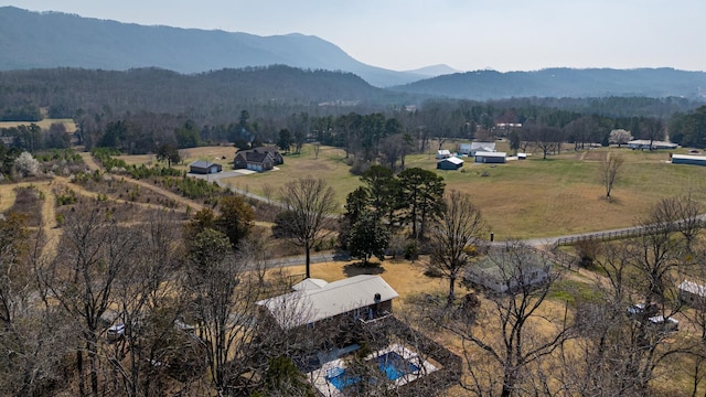 aerial view with a rural view, a mountain view, and a view of trees