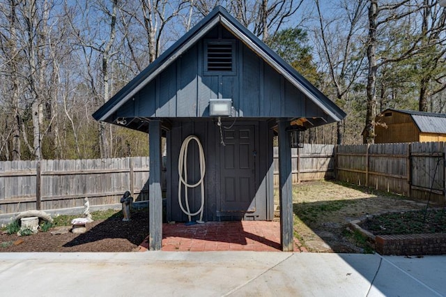 view of shed featuring a fenced backyard