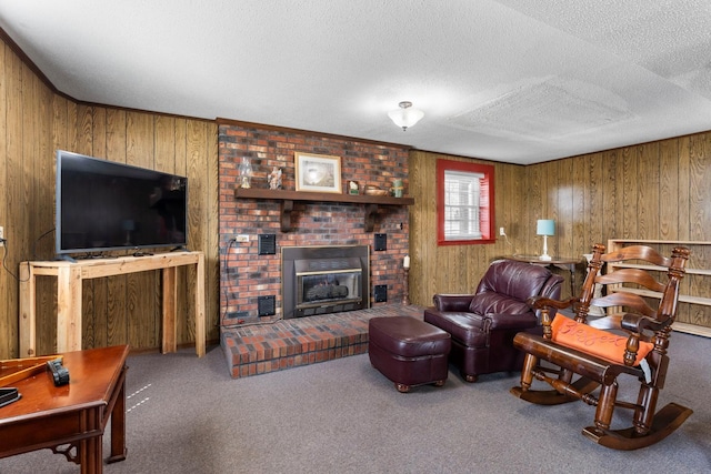 carpeted living area featuring a textured ceiling, a brick fireplace, and wooden walls