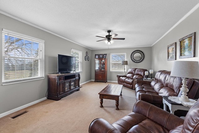 living room featuring baseboards, visible vents, a textured ceiling, crown molding, and light colored carpet