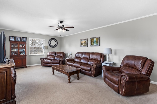 living area featuring light carpet, ceiling fan, crown molding, and baseboards