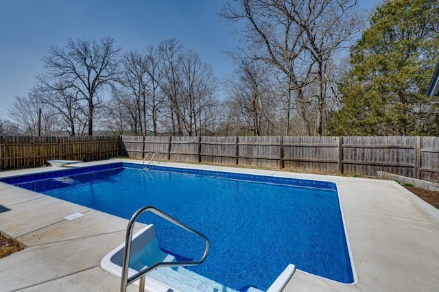 view of swimming pool featuring a fenced in pool, a patio, and a fenced backyard