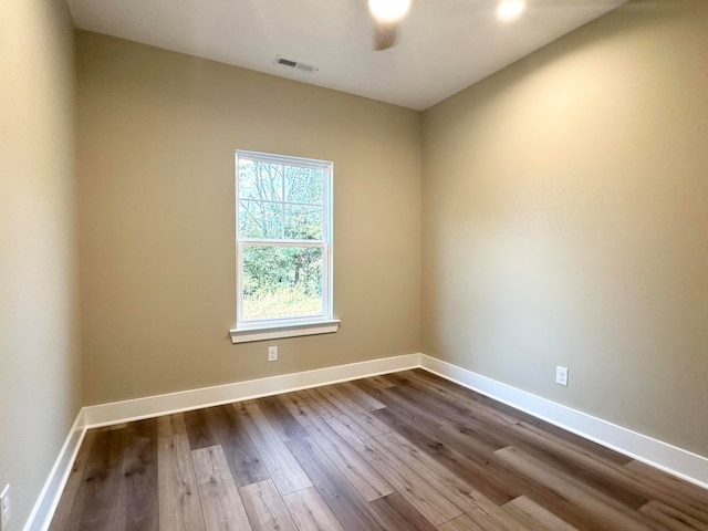 spare room with hardwood / wood-style flooring