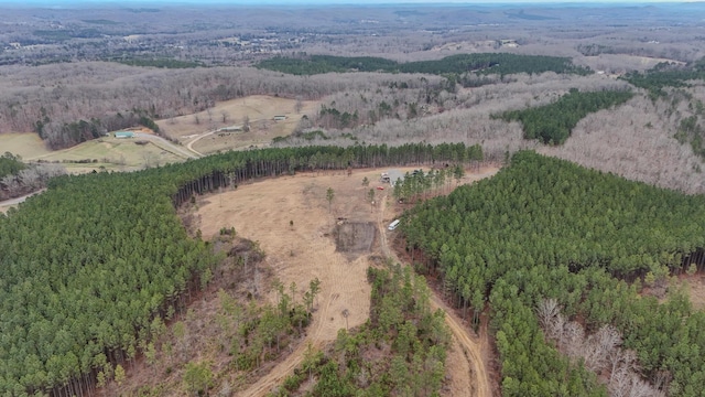 birds eye view of property with a forest view