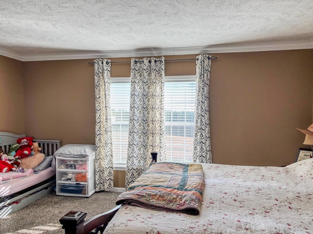 bedroom featuring a textured ceiling, ornamental molding, and carpet flooring