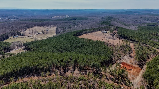 birds eye view of property with a view of trees