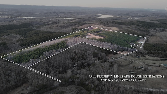 birds eye view of property with a wooded view