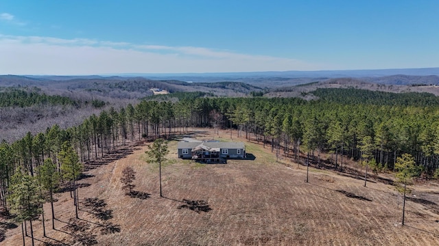 bird's eye view featuring a forest view and a rural view