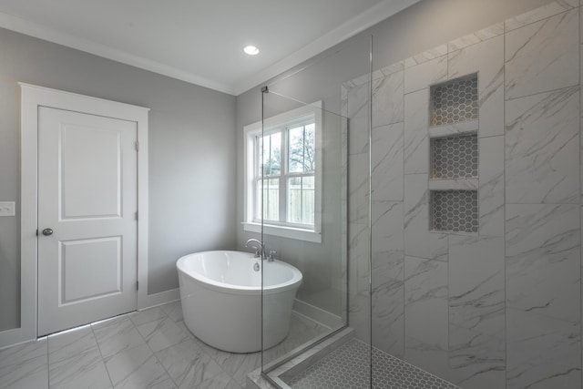 bathroom featuring marble finish floor, a marble finish shower, a soaking tub, ornamental molding, and baseboards