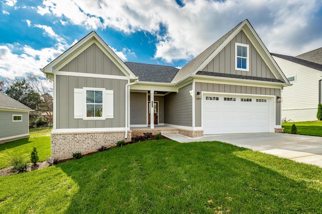 view of front of home with board and batten siding, a front yard, concrete driveway, and brick siding