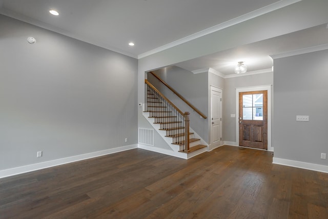 foyer featuring crown molding, stairs, baseboards, and dark wood-type flooring