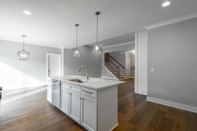 kitchen with pendant lighting, white cabinetry, a sink, and stainless steel dishwasher