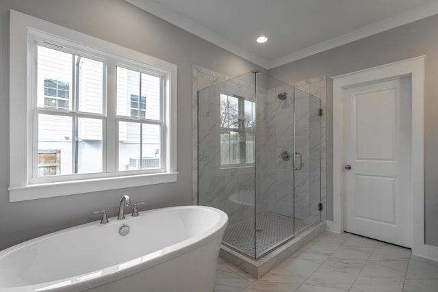 bathroom with marble finish floor, a freestanding tub, a marble finish shower, and crown molding