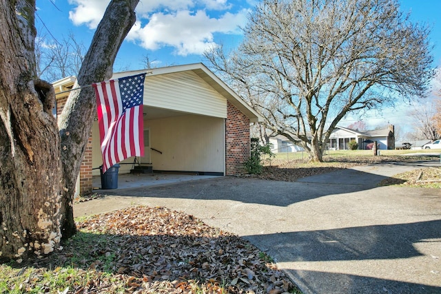 view of home's exterior with a carport