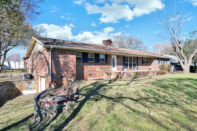 single story home with a garage and a front lawn