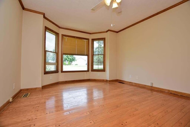 empty room with light hardwood / wood-style floors, ceiling fan, and ornamental molding